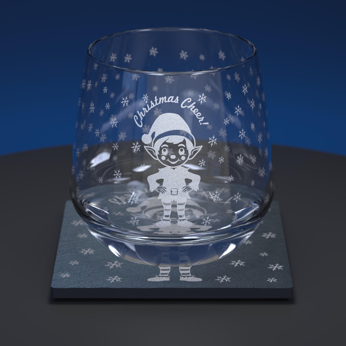 glass whiskey tumbler set engraved with a christmas elf and Christmas Cheer text together with matching slate coaster