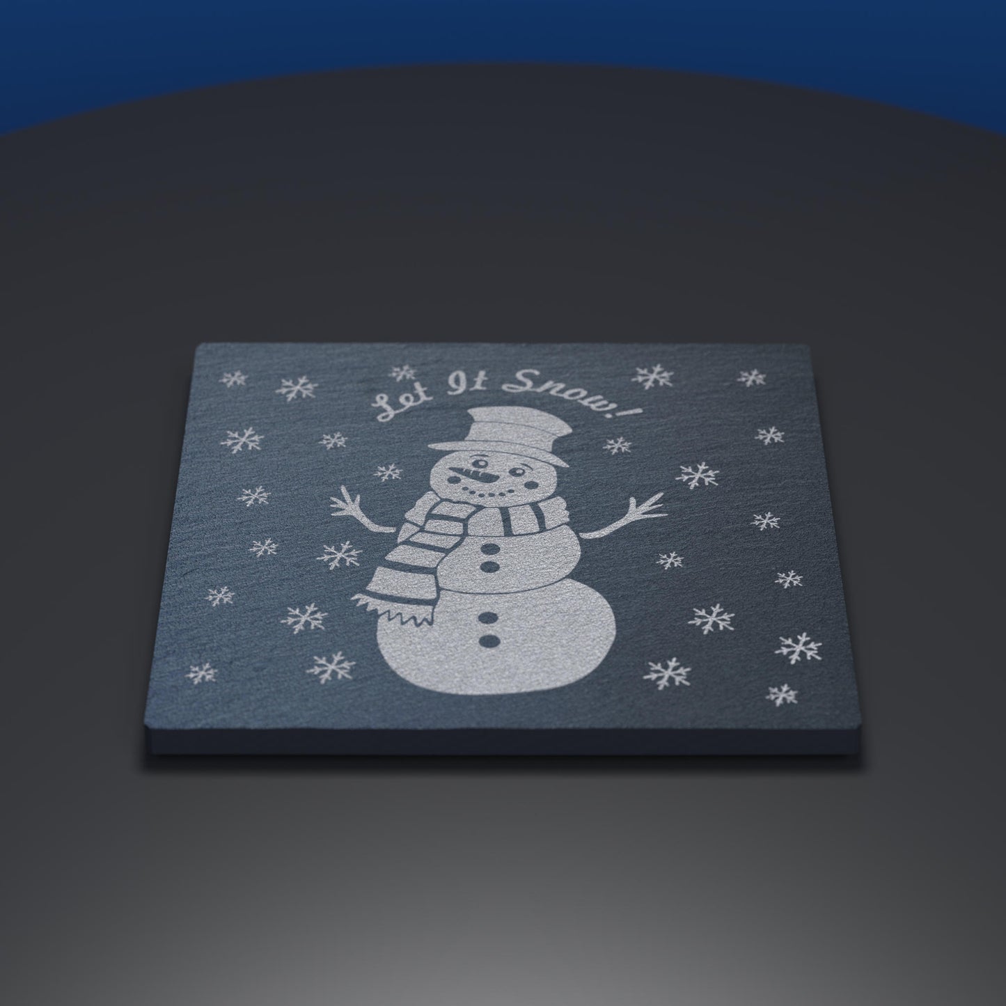 Slate coaster engraved with a cartoon snowman and Let it Snow text