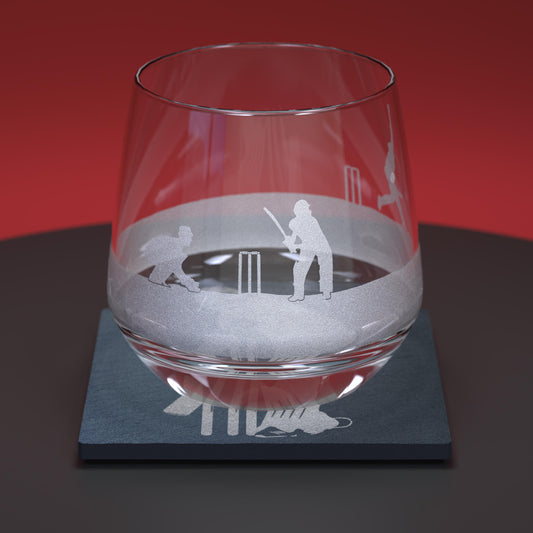 glass whisky tumbler engraved with a cricket design together with a matching slate coaster