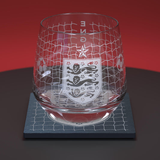 glass whiskey tumbler engraved with England football logo and football net design, together with matching slate coaster