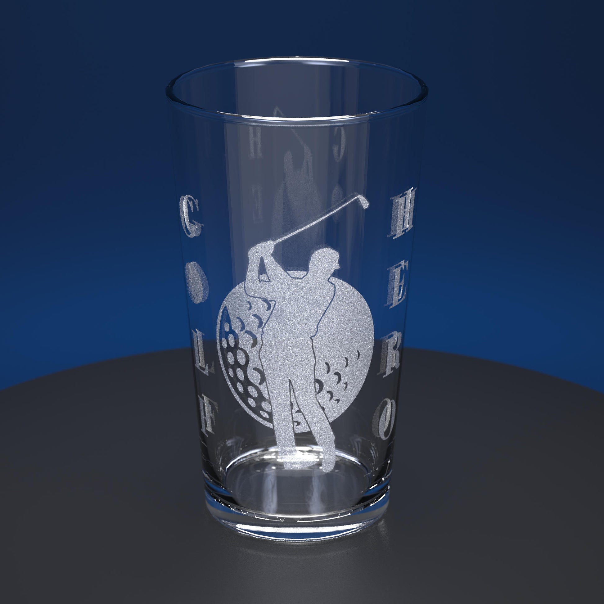 Pint glass engraved with a golfer and golf ball with the words Golf Hero