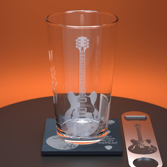 Pint glass set including glass, slate coaster and stainless steel bottle opener engraved with an electric guitar and amp with the words Eat, Sleep, Play, Repeat