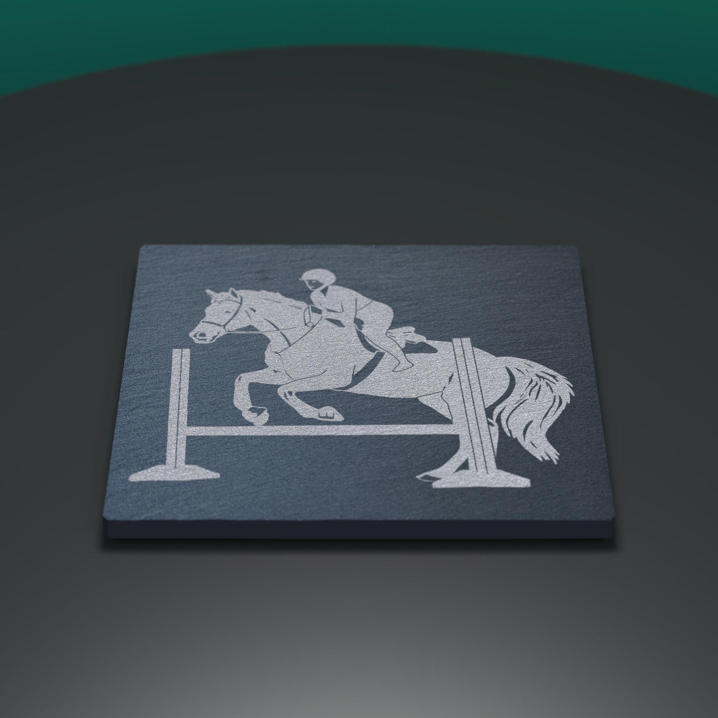 Slate coaster engraved with horse jumping scene