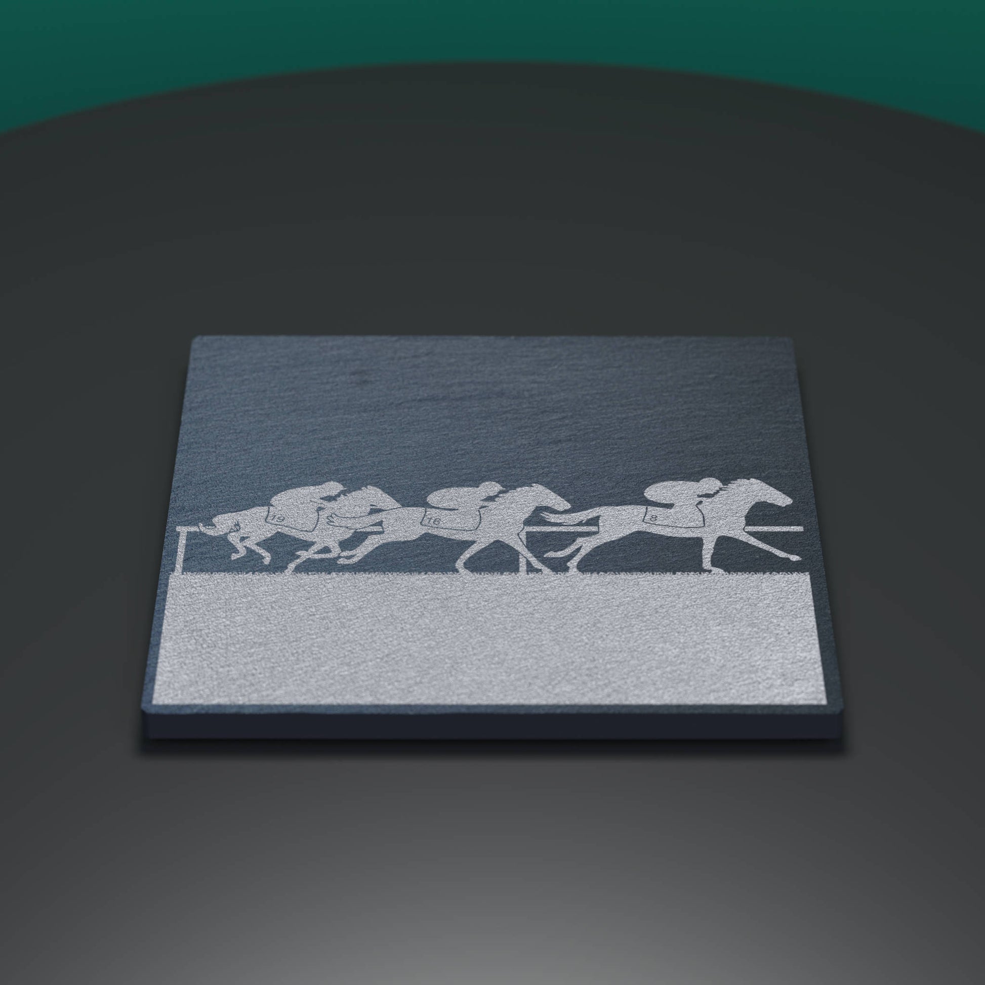 Slate coaster engraved with a horse racing scene