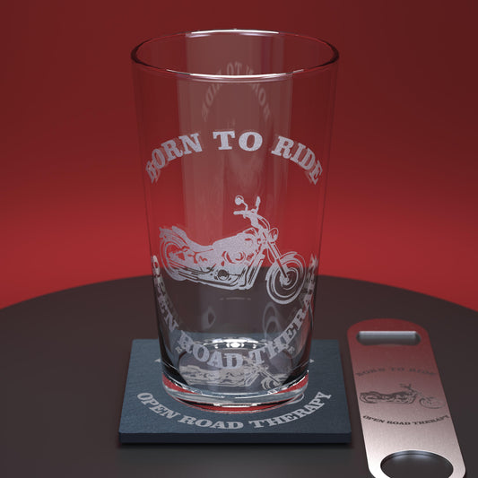 Pint glass set comprising of a glass, slate coaster and stainless steel bottle opener engraved with motorbike and words Born to Ride - Open Road Therapy