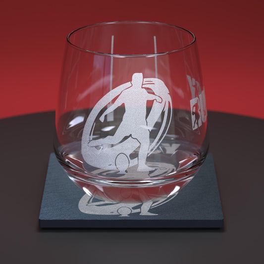 Glass whiskey tumbler set comprising of glass and slate coaster engraved with rugby player, ball and rugby goal posts