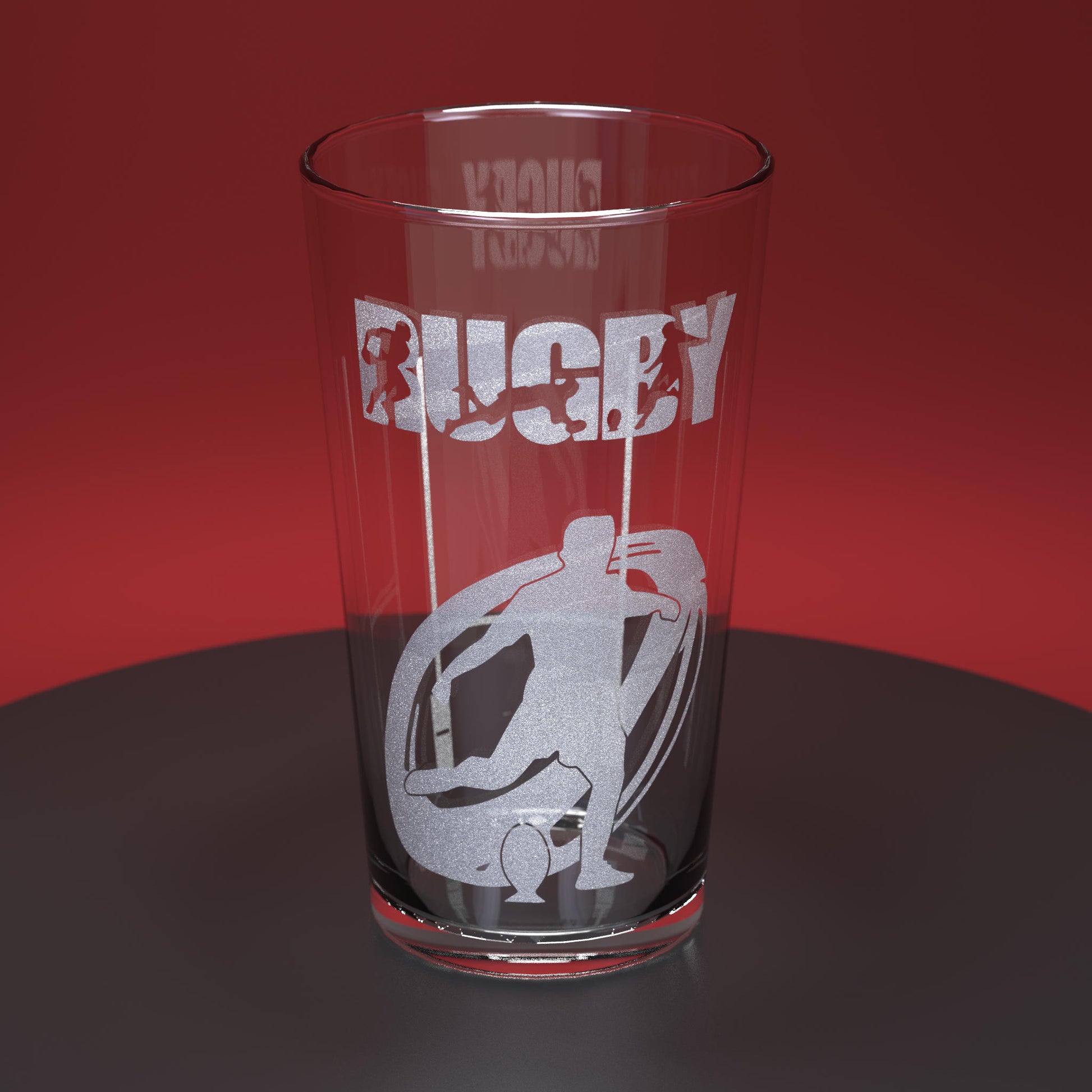 Pint glass engraved with rugby player and ball with the word Rugby