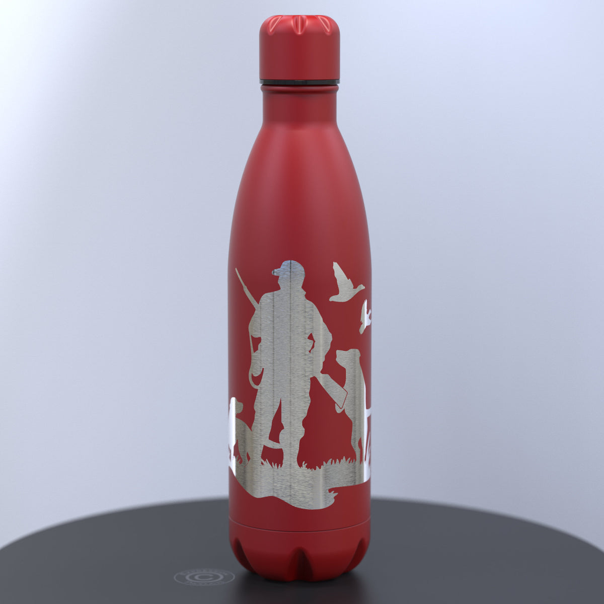 A red insulated water bottle with a silver engraved hunting silhouette design