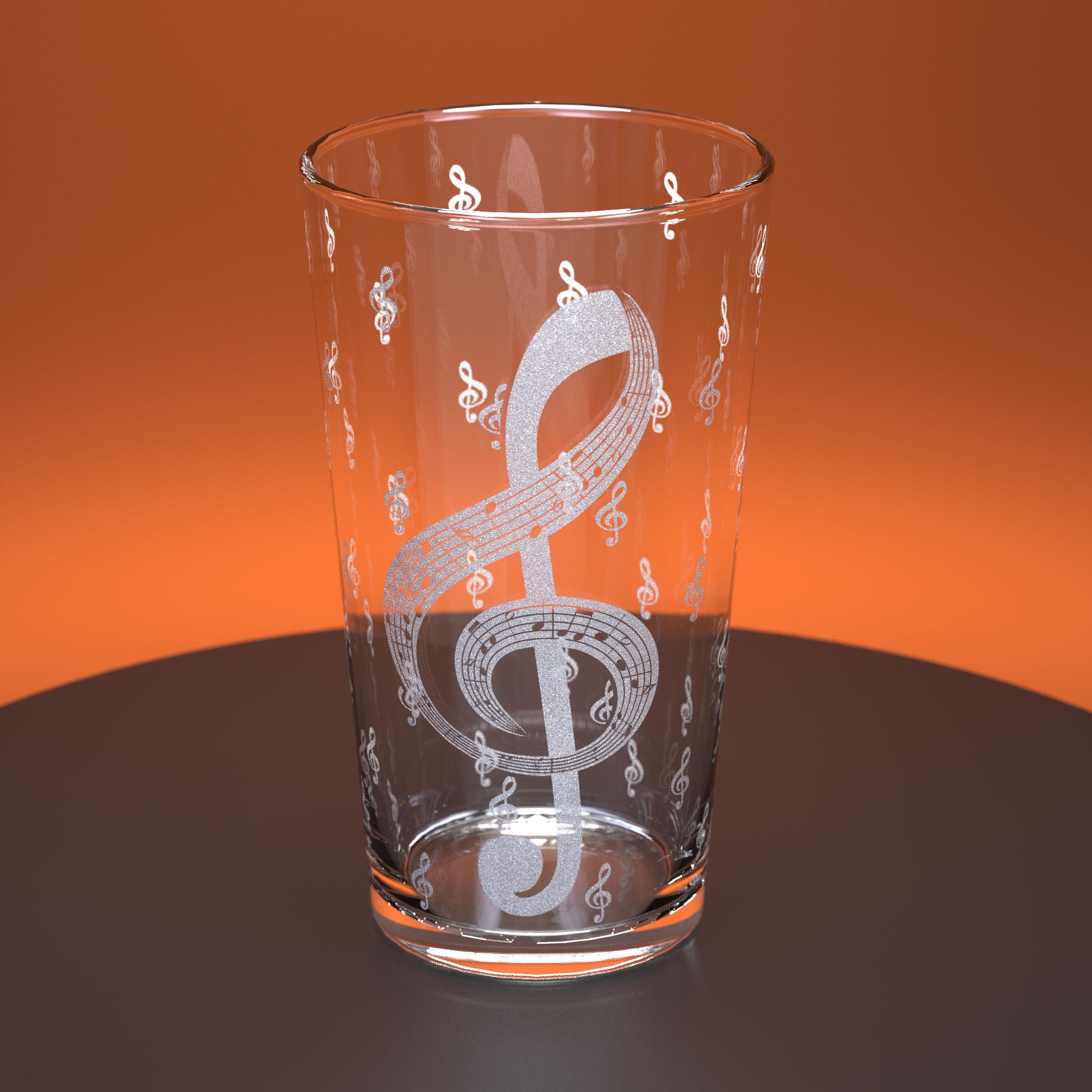 Pint glass engraved with treble clefs