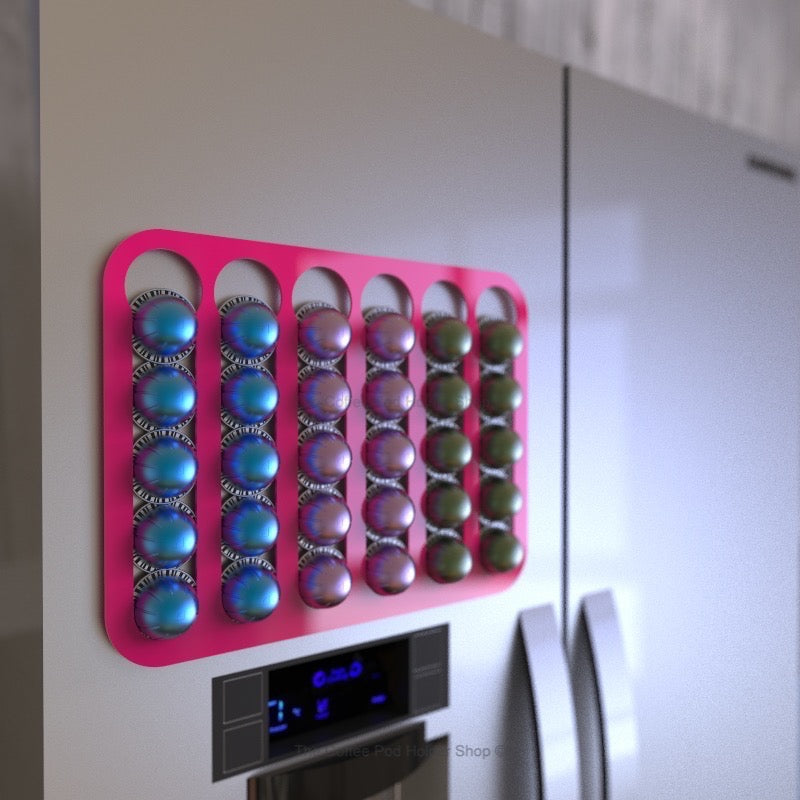 Magnetic Nespresso Vertuo capsule holder shown in pink on fridge door